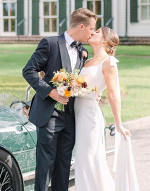 Photo from Verità. A Bridal Boutique, a bride and groom kissing.