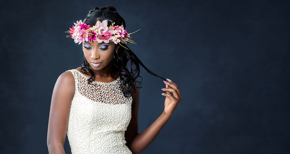 A bride in her wedding dress with flowers in her hair